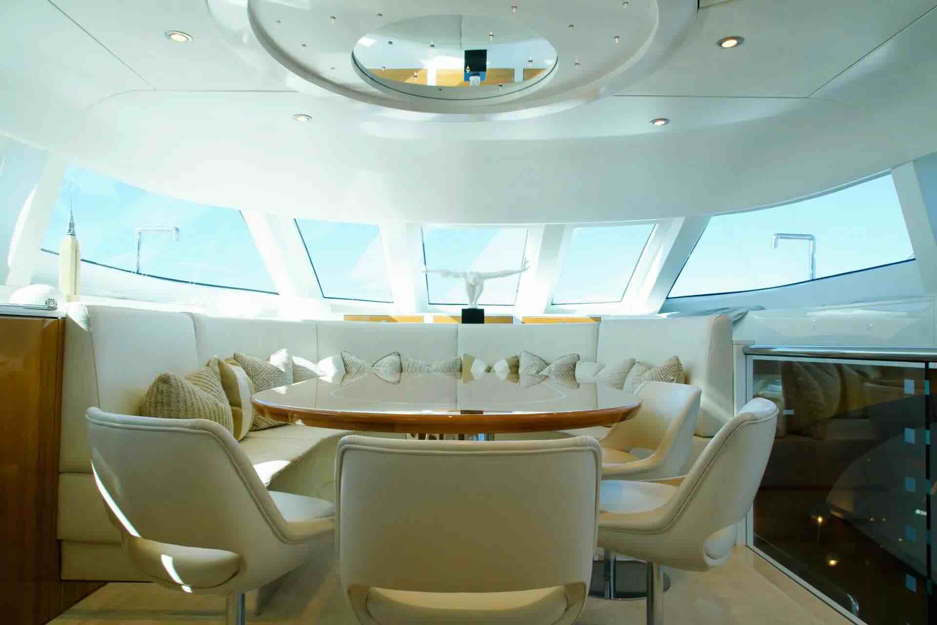 Dining area with sea-level windows aboard SEA BREEZE ONE